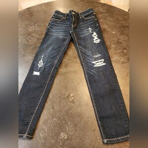White House Black Market Blue Skinny Jeans with Vintage Distressing